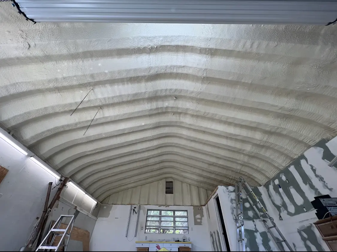 Spray polyurethane foam applied to the underside of a metal roof deck in Fallston